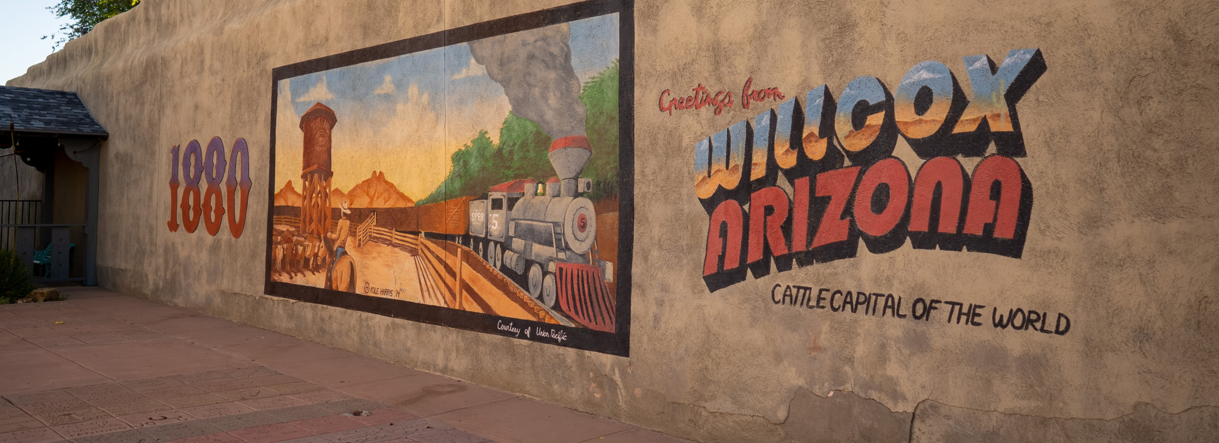 wall mural that reads "greetings from willcox arizona, cattle capital of the world"